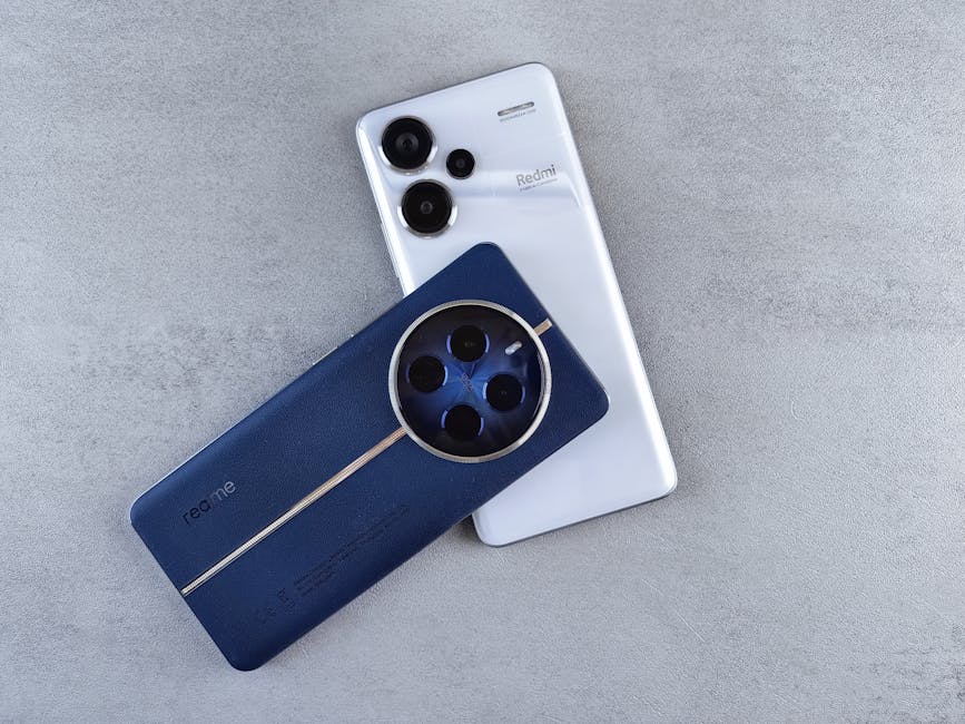 Close-up of two smartphones with unique designs on a minimalist surface, showcasing sleek technology.